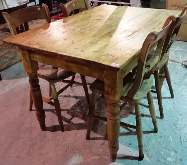 A Victorian pine plank top kitchen table, with single end drawer, on turned tapering supports, 121cm long x 78cm deep x 74cm high.  I7