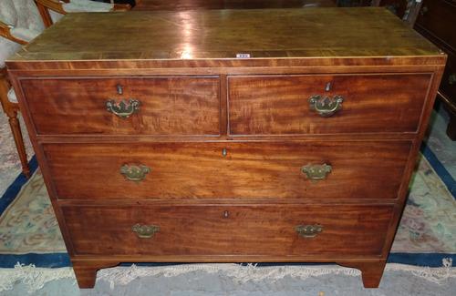 A George III mahogany and box strung low chest of two short and two long drawers on bracket feet, 104cm wide x 81cm high.  K7
