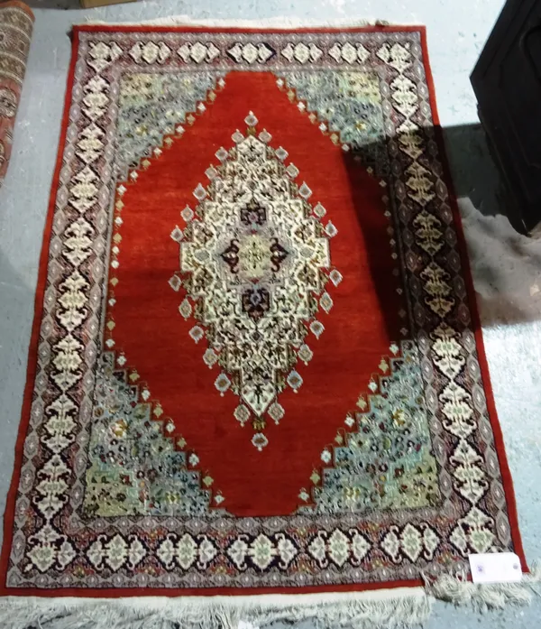 An Indian rug of Persian design.  E6