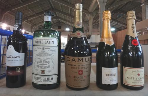 Twelve bottles of mixed port and spirits, comprising; a 1976 Fonseca vintage port, a 1963 Cavendish LBV port, a 1983 Offley Boa Vista vintage port, a