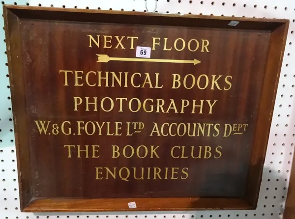 A sign for 'Foyle's Bookshop', with gilt lettering on mahogany.  CAB