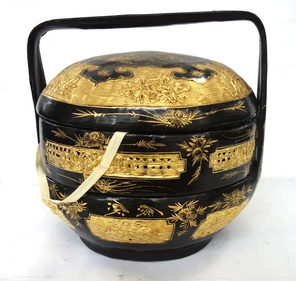 A Thai lacquer three-part basket, 20th century, gilt with birds and flowers on a black ground, 33cm high. 14
