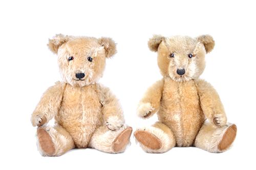 A Chilterns musical teddy bear, and one other Chiltern's teddy bear, each with golden fur, orange glass eyes and jointed limbs, 43cm high, (2). Illust