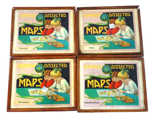 Four 'Superior Dissected Maps' mid-20th century wooden printed puzzles, comprising; England & Wales, Scotland, Europe and Asia, boxed, (4).