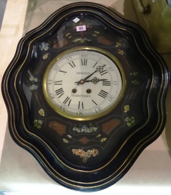 An ebonised glazed wall clock, with mother of pearl inlay.  S1