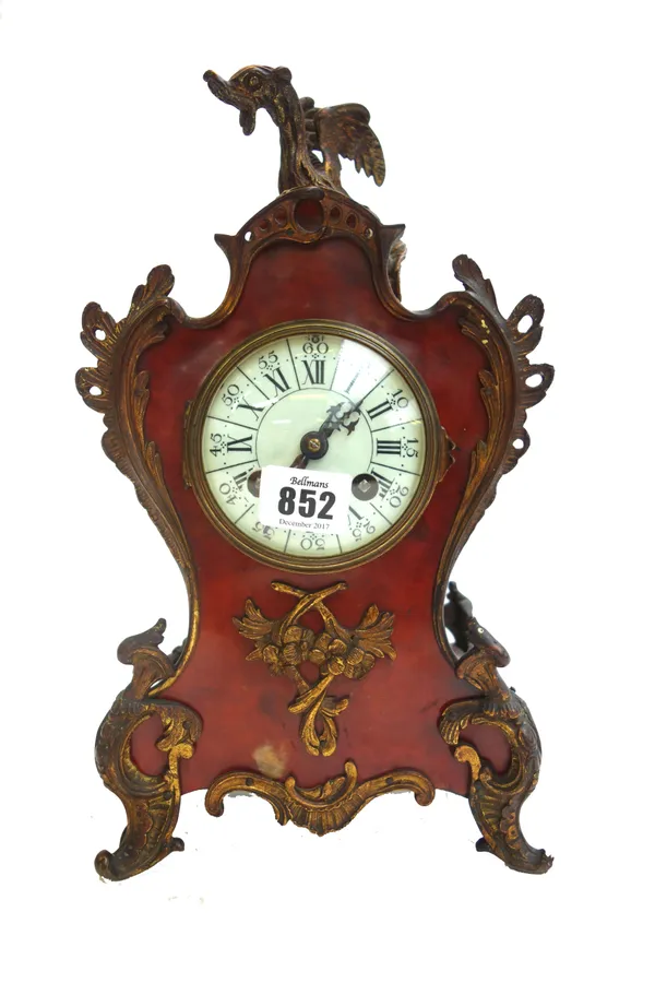 A French faux tortoiseshell and brass mounted mantel clock, early 20th century, with dragon finial and white enamel dial, enclosing a two train moveme