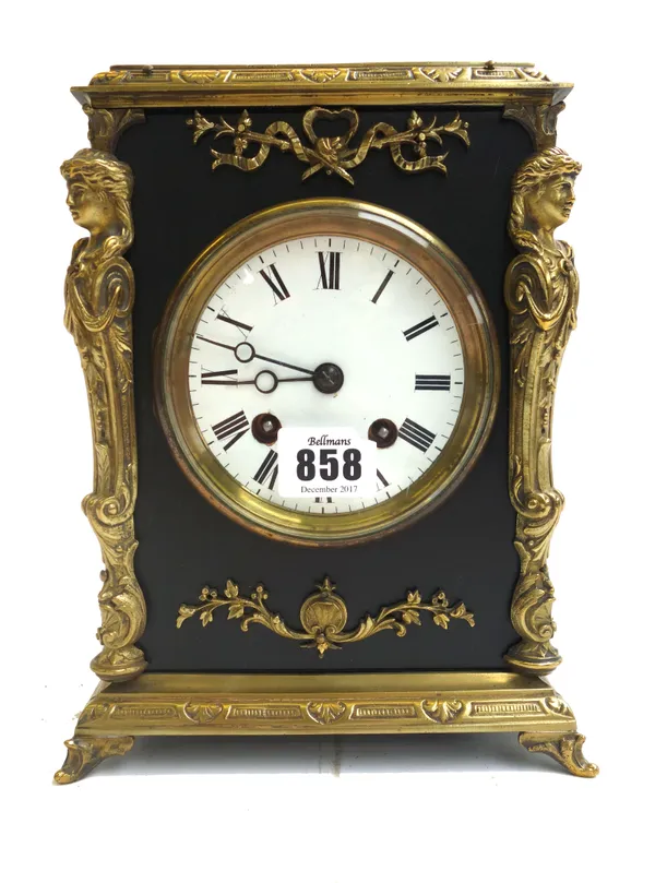A French brass mounted mantel clock, late 19th century/ early 20th century, the ebonised rectangular case with all over brass embellishments, enclosin