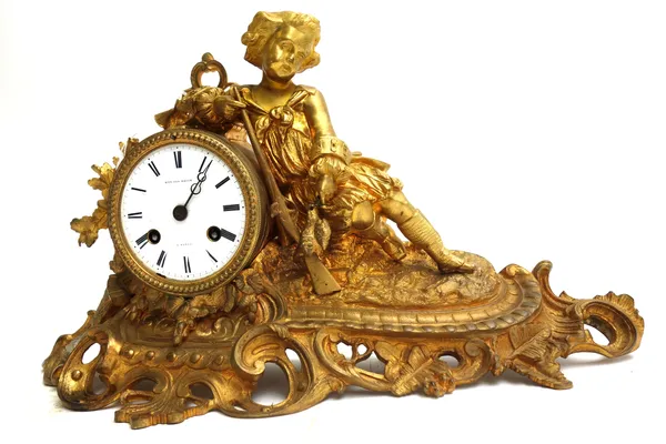 A French gilt metal mantel clock, 19th century, by Edward Brighton, Paris, with figural hunter surmount over a drum case with white enamelled dial det