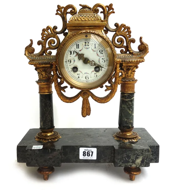 A French gilt metal and marble mantel clock, late 19th century, with a circuar drum case and foliate painted white enamel dial flanked and supported b