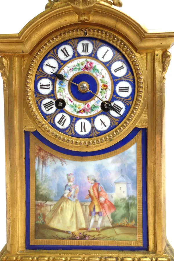 A French gilt bronze and porcelain mantel clock, 19th century, with figural urn surmount over a foliate painted porcelain dial and Sevres style plaque