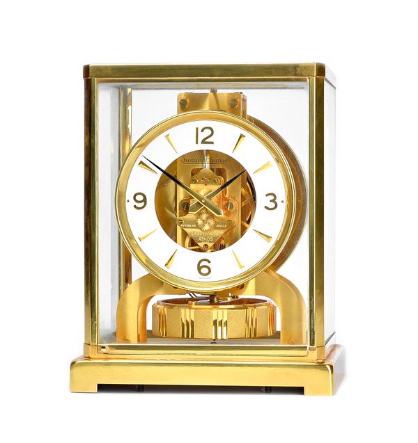 A Jaeger Le Coultre brass cased Atmos clock, serial No.564677, of canted rectangular form, 22.5cm high.  Illustrated