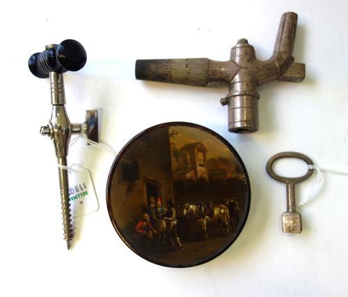 A tortoiseshell circular box and cover, early 19th century, the lid painted with village street scene (9cm diameter), a chromed champagne tap with tur