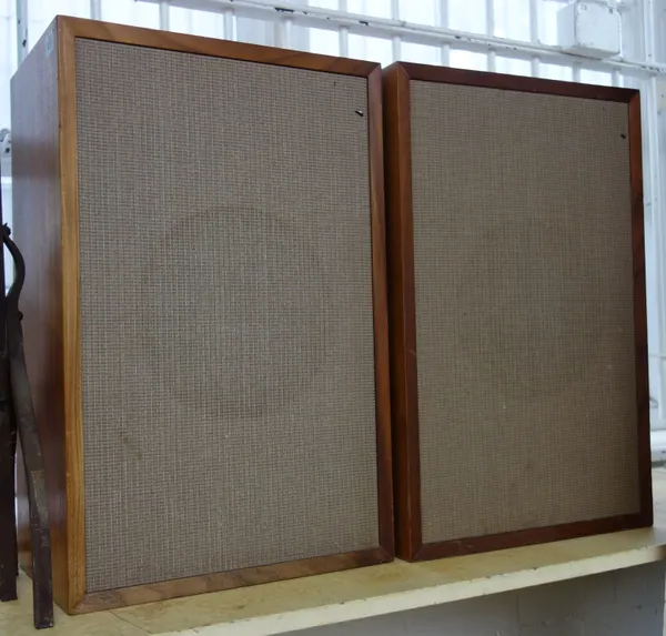 A pair of Tanoy Speakers, circa 1970, teak cased with acoustic cloth fronts, stamped 'ET52', with paper label to rear 'Serial No 125114', 'LSU/HF/3LZG