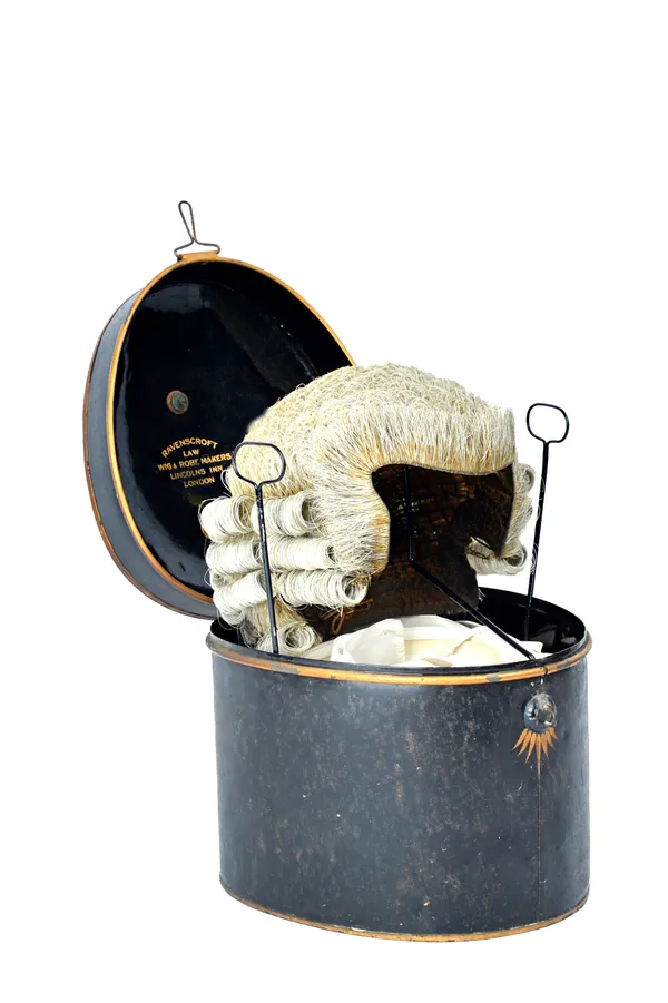 A barrister's wig, late 19th/early 20th century, with interior label 'Patentee', housed in a gilt and ebonised tin box detailed 'Ravenscroft Law Wig &