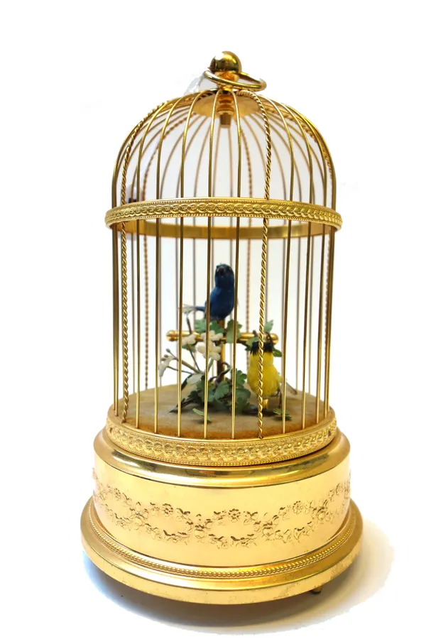 A modern Swiss birdcage automaton by 'Rouge Music', with two brightly feathered birds housed under a gilt wire dome, winding key to base, stamped mark