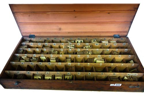 An unusual set of painted wooden alphabet letters contained in a fitted wooden box, 76cm wide, a glass display dome containing a wax doll, 23cm high,