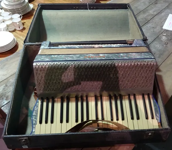 A cased piano accordion.  H2