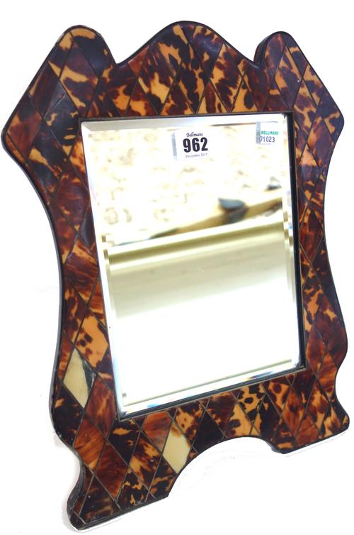 A tortoiseshell and inlaid strut back table mirror, 19th century, of irregular outline (36cm high), a terracotta nude female figure, a Georgian style