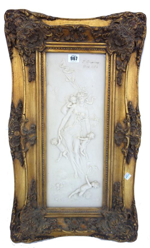 A modern faux marble plaque relief carved with a classical maiden and cherub attendants, incised 'F. Duquesany, Paris 1892', 66cm x 39cm, framed, and