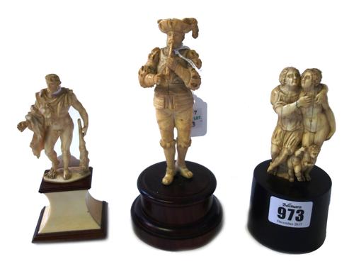 An 18th century carved ivory figure group depicting figures in an erotic embrace, with cherub to the base (9cm high), an early 19th century carved ivo