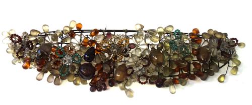 An early 20th century Corbeil wall light, the basket shaped beadwork frame hung with coloured moulded glass fruit, 59cm wide.