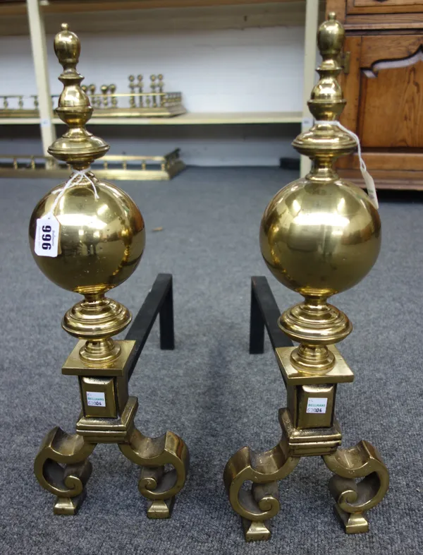 A pair of Dutch style brass andirons, 19th century and later, of turned bulbous form, each 50cm high, (2).