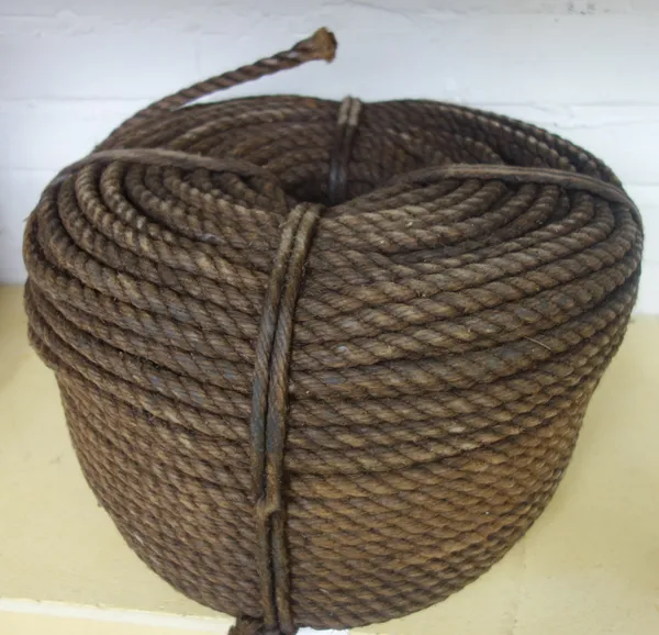A coil of tarred hemp rope, 40cm diameter.