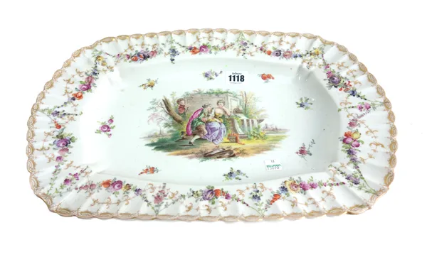 A Dresden style porcelain shaped dish, 20th century, decorated with a courting couple within a gilt decorated wide fluted border, 43cm wide, together