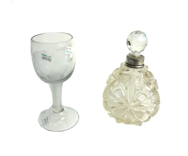 A silver-mounted cut glass scent bottle and facet cut ball stopper, late 19th century, of drum form, cut with panels of raised diamonds, the silver co