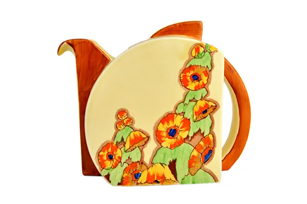 A Clarice Cliff teapot and cover, of Stamford shape, circa 1937, decorated in the 'Sunshine' pattern, printed marks, 11.5cm high.  Illustrated