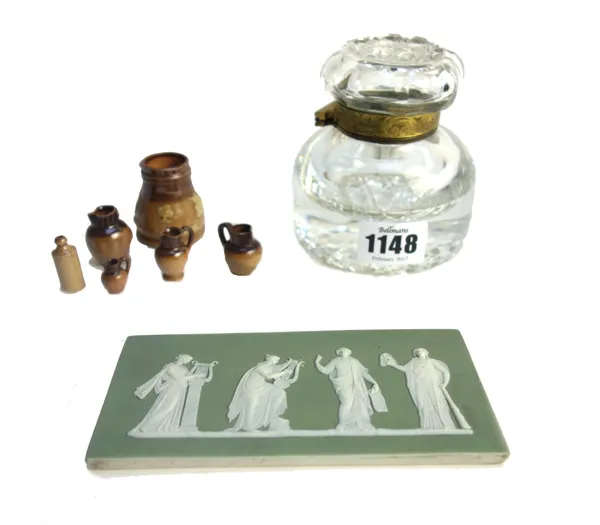 A Wedgwood green jasper plaque detailed with classical figures, 13cm wide, a Victorian glass inkwell and six Doulton harvest ware miniatures (8).