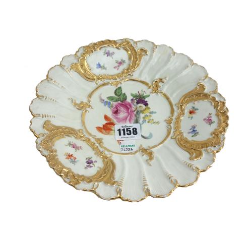 Three Meissen cabinet plates, 20th century, foliate decorated against a gilt foliate ground (29cm diameter), a matching blue ground cabinet plate, blu