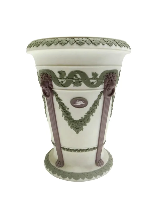 A Wedgwood three-colour jasper vase, late 19th century, applied in lilac and green with four lion masks, pilaster and paw feet suspending flower swags
