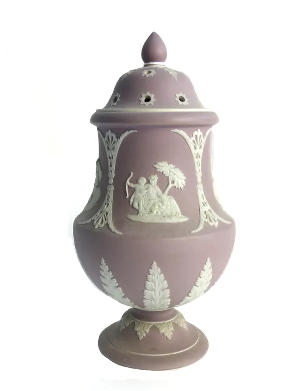 A Wedgwood lilac jasper ware vase and pierced cover, late 19th century, decorated with classical figures and opposing ferns against an urn shaped body