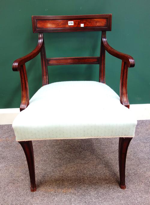 A Regency mahogany bar back carver chair on sabre supports, 55cm wide x 84cm high.