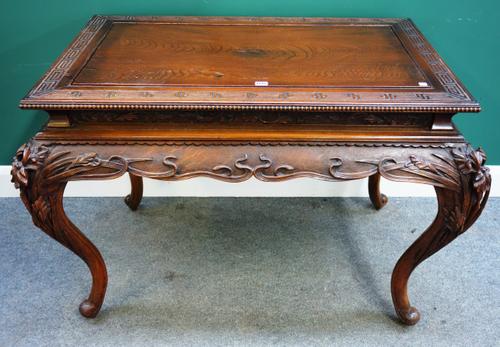 A late 19th century Chinese carved rectangular hardwood centre table, on cabriole supports, 120cm wide x 80cm deep.