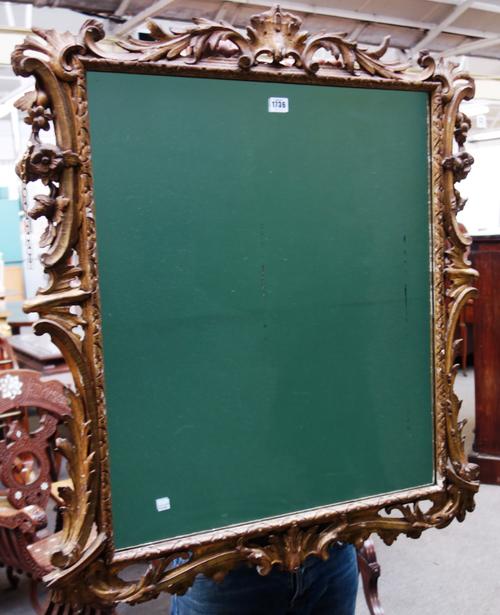 An early 19th century continental gilt framed wall mirror, with acanthus and floral mounted frame, 83cm wide x 98cm high.