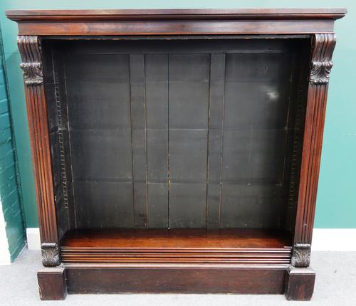A Victorian rosewood floor standing open bookcase with scroll mounts, 143cm wide x 142cm high.