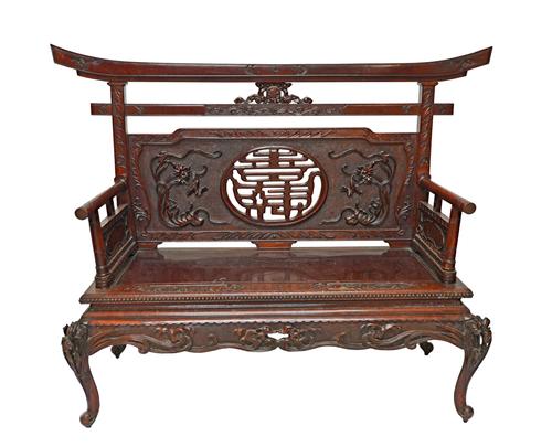 A late 19th century Chinese red stained hardwood hall bench, with pierced and carved decoration, 158cm wide x 120cm high.  Illustrated