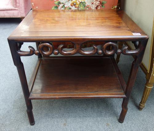 A 19th century Chinese low rectangular table, with pierced frieze on in-stepped turned supports, united by platform undertier, 61cm wide x 62cm high.