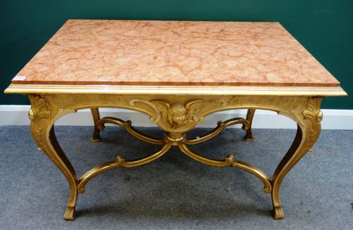 A.B.C.E. Jonsson, 32 Hornsgatam, Stockholm; an 18th century style gilt framed centre table, with inset rectangular marble top, 110cm wide x 71cm high.