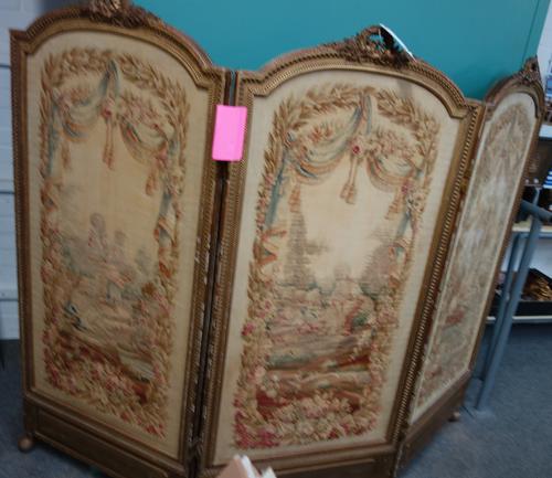 A late 19th century French gilt framed arch top three fold screen, with inset tapestry panels, 207cm wide x 156cm high.