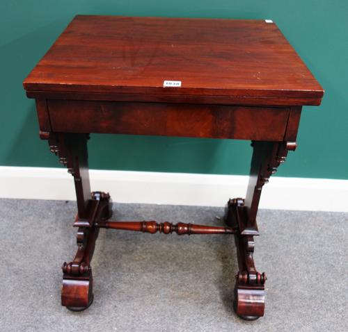 An early Victorian mahogany occasional/work table, the fold over rectangular top over single frieze drawer, on trestle end standards, 56cm wide x 73cm