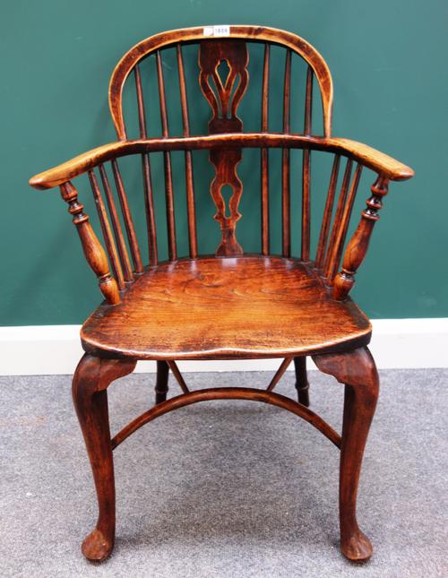 A George III oak and elm bow back Windsor chair, with crinoline stretcher, 60cm wide x 89cm high.