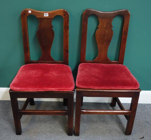 A set of six George II oak framed vase back dining chairs, with solid seats, on block supports. (6)