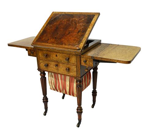 Probably Gillows; an early 19th century rosewood drop flap work table, with angle adjustable top on reeded supports, 71cm wide x 77cm high.  Illustrat
