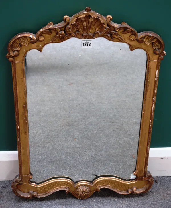 A 19th century gilt framed mirror, with shell moulded crest, 47cm wide x 75cm high.