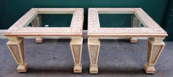 A pair of 20th century cream painted parcel gilt faux marble coffee tables, with glass inset Greek key square tops, each 72cm wide x 72cm high, (2).