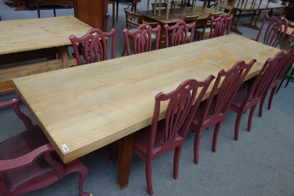 A large elm four plank table top, on associated oak base, the top 86cm wide x 299cm long x 65cm deep.