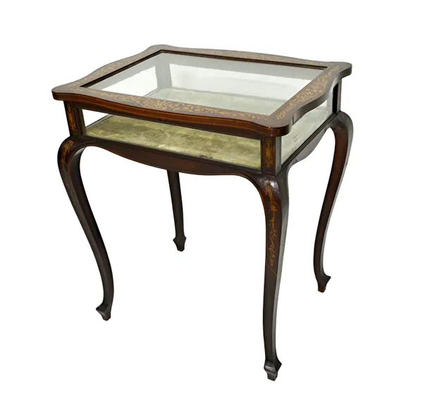 A late 19th century marquetry inlaid mahogany bijouterie table of serpentine outline, 65cm wide x 75cm high.  Illustrated